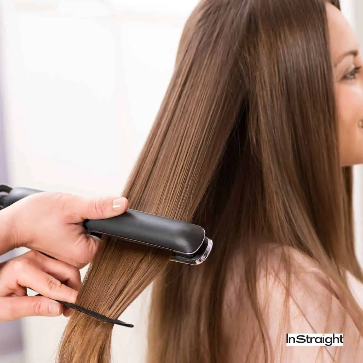 hair stylist using a titanium straightener (titanium straightener vs ceramic straightener)